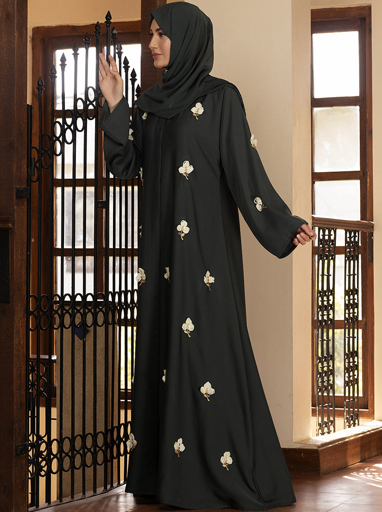 Black chiffon abaya featuring a flowy silhouette adorned with contrast  embellishment.